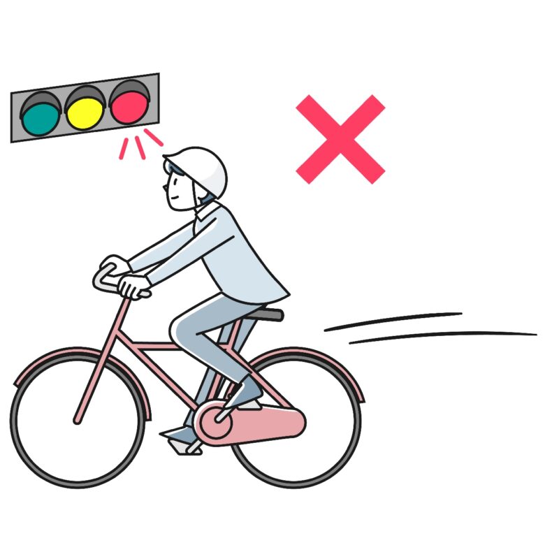 信号を無視して自転車で走る若い男性